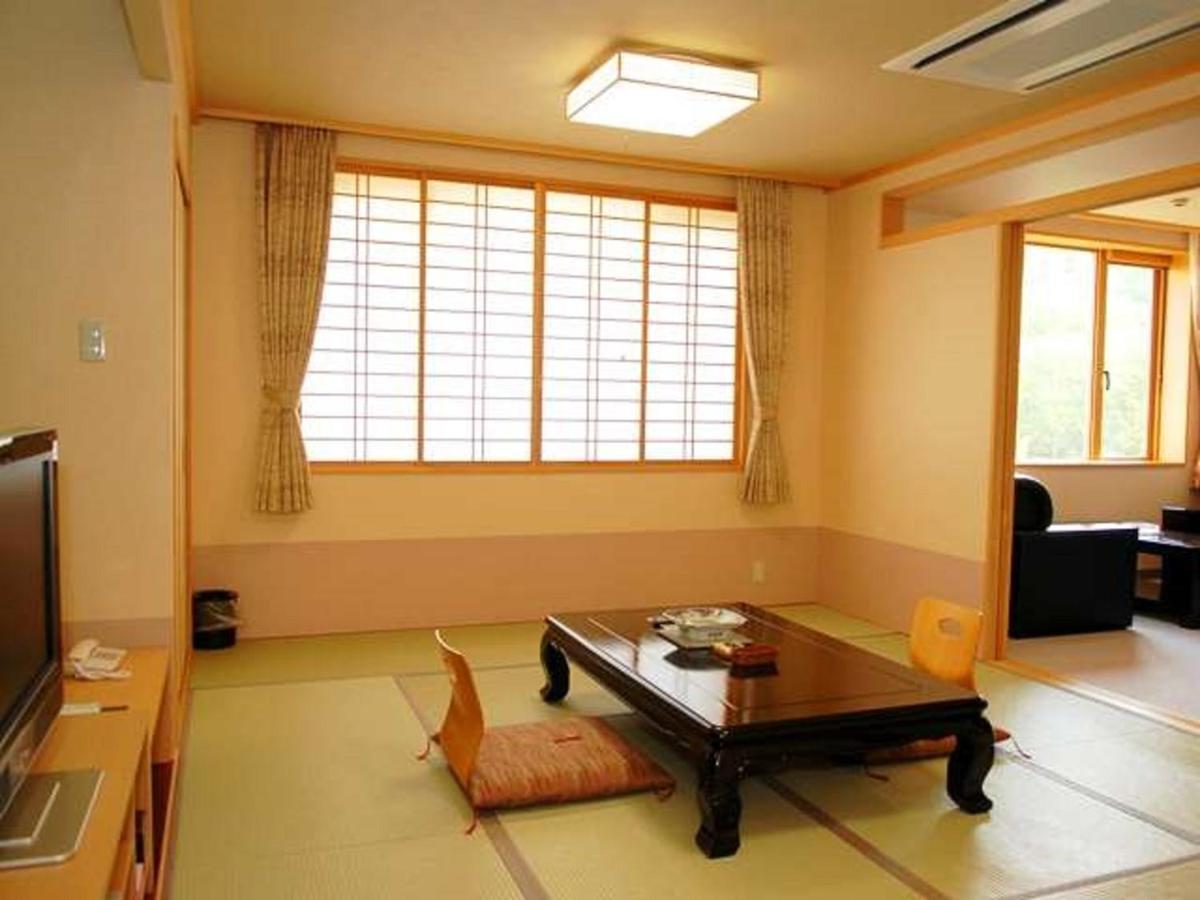 Отель Yunokaku Ikedaya Teshikaga Экстерьер фото